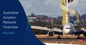 Plane on tarmac in front of Sydney Air Traffic Control Tower